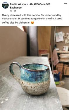 a coffee cup sitting on top of a wooden table