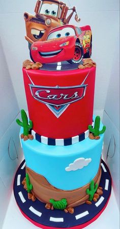 a birthday cake with cars on top