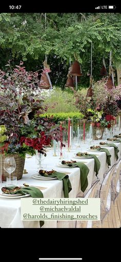 an image of a table setting with flowers in vases