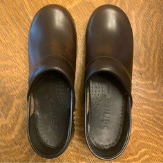 Never Worn Outdoors. Small Scuffs. Minimal But See Pictures Please. Questions? Leave A Comment Below! Casual Brown Non-slip Clogs, Brown Non-slip Slip-on Clogs, Brown Slip-on Clogs With Rubber Sole, Brown Non-slip Clogs, Brown Slip-resistant Synthetic Clogs, Sanita Clogs, Nursing Clogs, Patent Shoes, Leather Clogs