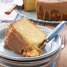 a piece of cake on a plate with a knife and fork in front of it