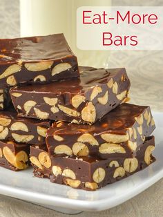 chocolate peanut butter bars stacked on top of each other with the words eat more bars above them