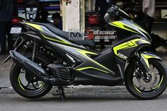 a yellow and black motorcycle parked on the street