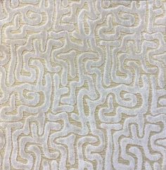 a close up view of a beige and white pattern