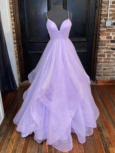 Bring the sparkle with a prom dress that brings the glitz! The ball gown features a plunging V-neck and a sexy open back with criss-cross straps. The dress is composed of glitter tulle fabric and makes you feel like a princess.

Deep V-neck
A-line, Ball Gown
Tulle
Layered
Floor Length
Lace Up Closure Sparkly Prom Dress, Purple Prom, Princess Prom Dresses, Stunning Prom Dresses, Purple Prom Dress, Prom Dress Inspiration, Cute Prom Dresses, فستان سهرة, Pretty Prom Dresses