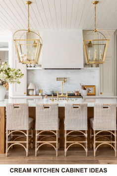 the kitchen is decorated in white and gold, with wicker chairs around the island