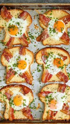 toasted eggs and bacon are arranged on top of each other