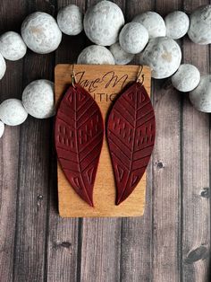 Genuine Leather embossed large leaf earrings in cranberry red.  S P E C I F I C A T I O N S - Earrings approximately 3.875" long (drop length) - Ear wire is antique bronze - Each pair comes with 2 rubber earring backs This listing is for one (1) pair of genuine leather layered earrings. **Please note that color may be slightly different due to monitor displays and pattern may be different due to the nature of the cut on the pattern. All earrings are made to order with care, so slight variations Layered Earrings, Embossed Jewelry, Earrings Ideas, Leather Crafts, Red S, Mom Gifts, Leaf Earrings, Earring Backs