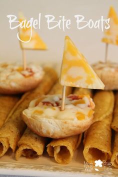 some food is sitting on a plate with little flags sticking out of it's top