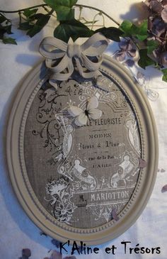 a white plate with a bow on top of it next to some flowers and leaves