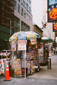 a food cart is on the side of the street