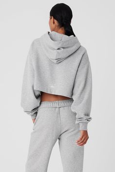 A cute and comfy counterpart to your high-waisted favorites, the Bae Hoodie has a relaxed fit, long scrunchable sleeves, ribbed cuffs and a slightly cropped ribbed hem that highlights the natural waist. The pocketless design is streamlined and bulk-free, and the French terry is an absolute pleasure to pull on: smooth on outside and fleecy on the inside. Stretch Ribbed Hooded Top, Winter Ribbed Hoodie For Loungewear, Alo Yoga Tops With Ribbed Cuffs For Loungewear, Hooded Ribbed Tops For Loungewear, Ribbed Hooded Top For Loungewear, Casual Stretch Ribbed Hoodie, Ribbed Hooded Hoodie For Loungewear, Ribbed Hoodie For Loungewear, Sporty Ribbed Sweatshirt For Loungewear