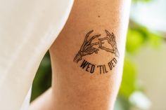 a woman with a tattoo on her arm that says we'll do it right