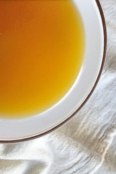 a white bowl filled with soup on top of a table