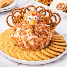 a turkey cheese ball sitting on top of crackers