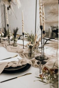 the table is set with black and white place settings