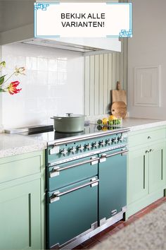 an image of a kitchen setting with green cabinets