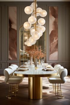 a dining room table with chairs and a chandelier