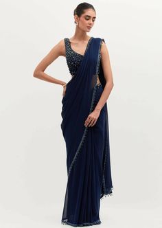 The signature and bestseller navy blue masoom sari! Embroidered in pearls all over, with a featured embroidered cape. Navy Blue Saree Party Wear, Navy Blue Kurti Design, Blue Bollywood Blouse For Formal Occasions, Blue Bollywood Formal Blouse Piece, Blue Bollywood Style Formal Blouse Piece, Blue Bollywood Embellished Pre-draped Saree, Traditional Blue Pre-draped Saree For Evening, Blue Embellished Saree With Traditional Drape, Blue Embellished Saree For Eid