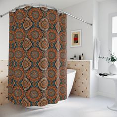 an orange and blue shower curtain is hanging in a white bathroom with a bathtub