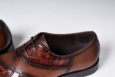 Sophisticated style lace-up dress shoes, crafted from cow leather and lined with pigskin, perfect for any formal outfit. Brown Leather Lace-up Shoes For Semi-formal Occasions, Brown Italian Oxfords For Work, Italian Cap Toe Oxfords For Office, Italian Wingtip Lace-up Shoes For Formal Occasions, Formal Italian Wingtip Lace-up Shoes, Elegant Brown Wingtip Oxfords, Brown Leather Sole Lace-up Shoes For Semi-formal Occasions, Brown Lace-up Shoes With Leather Sole For Semi-formal Occasions, Elegant Brown Wingtip Lace-up Shoes