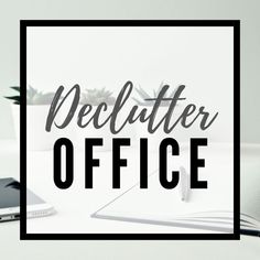 the word declutter office on top of a desk next to a cell phone