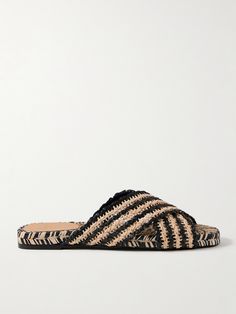 Castañer's 'Pat' slides are set on the same jute soles as the brand's signature espadrilles - they're woven on a one-of-a-kind machine created by founder Tomás Serra himself. Handcrafted from two-tone raffia, they have crisscrossing straps and leather pads at the heels for comfort. Slip-on Espadrilles With Textured Footbed For Vacation, Black Sandals With Woven Sole For Beach, Straw Sandals With Textured Sole For Vacation, Black Straw Sandals For Beach, Vacation Sandals With Textured Straw Sole, Vacation Straw Sandals With Textured Sole, Casual Black Woven Sandals, Black Woven Sandals For Vacation, Natural Espadrilles With Textured Footbed For Vacation