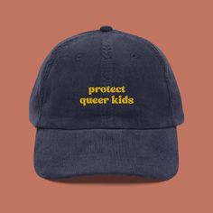 Stand up, stand out, and protect queer kids with our stylish Protect Queer Kids Corduroy Hat! This isn't just any hat--it's a powerful statement piece that champions inclusivity and celebrates the future generations of the LGBTQIA+ community. Let your hat do the talking and elevate your style with our embroidered vintage cap. Meticulously crafted from premium 100% cotton corduroy, this hat ensures a gentle feel against your skin and a comfortable fit. Its timeless design features an adjustable s Weird Sweaters, Mode Queer, Queer Outfits, Kids Corduroy, Embroidered Corduroy, Corduroy Cap, Dope Hats, My First Rodeo, Corduroy Hat