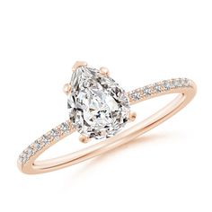 an oval cut diamond ring with pave set shoulders