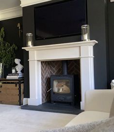 a living room with a fireplace and tv above it