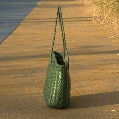 This woven leather handbag is handy. 'Carla' tote that's perfect for everyday use. It features soft yet durable vegetable tan calf leather. Handmade by experienced artisan. Vegetable tanned calf leather - soft and durable.  Use delicate cream to clean and care for the leather. Casual Green Woven Leather Shoulder Bag, Everyday Green Shoulder Bag With Intrecciato Weave, Green Woven Leather Shoulder Bag For Errands, Eco-friendly Woven Leather Shoulder Bag For Everyday Use, Eco-friendly Everyday Shoulder Bag With Woven Leather, Green Bucket Bag With Braided Handles, Green Bucket Bag With Braided Handles For Everyday, Eco-friendly Woven Leather Bucket Bag For Everyday, Natural Woven Leather Bags For Errands