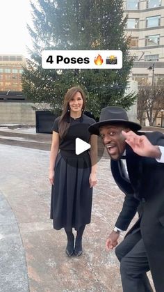 a man in a suit and hat standing next to a woman wearing a black dress