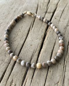 Beautiful Petoskey stone beads!  Have a bracelet custom made just for you! https://kathybankston.com/products/petoskey-fossil-coral-bracelet-small-4mm-brown-stone-bead-bracelet Fossil Bracelet, Fossilized Coral, Petoskey Stone, Brown Stone, Coral Bracelet, Fossil Coral, Jewelry Studio, Beading Wire, Coral Beads