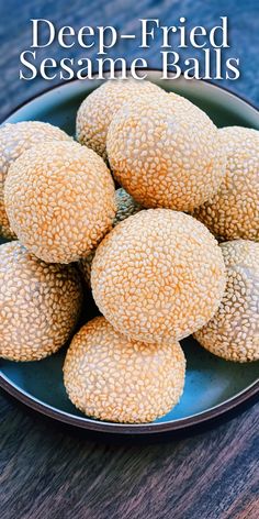 several sesame balls on a plate with the title overlay reads deep - fried sesame balls