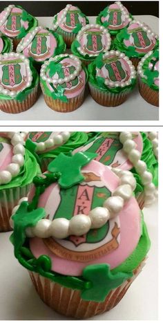 cupcakes decorated with green and pink icing are displayed on a white table