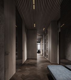 an empty hallway with wooden slats on the ceiling and benches in the foreground