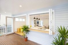 the inside of a house with wood floors and white walls