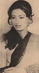 an old black and white photo of a woman with a sash around her neck looking at the camera