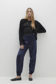 The Sherry Silk Jogger is the epitome of luxurious loungewear. Featuring a drawstring waist and practical pockets, these silk joggers offer both comfort and elegance for a relaxed yet sophisticated look. 100% Silk Charmeuse Jogger Elastic waist with drawstring Slit pockets 40 1/2" total length, 29" inseam, 12 3/4" rise (size small) Dry Clean Only Luxurious Loungewear, Silk Joggers, Silk Charmeuse, Navy Color, Jogger Pants, Drawstring Waist, Jumpsuit Dress, Sweater Top, Sweater Cardigan