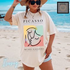 Modern abstract art Picasso tee. This is the vintage style Comfort Colors shirt with a trendy design that women adore. When ordering, please refer to size chart.  Please refer to size chart for best fit and order up 1-2 sizes for an oversized look. NO RETURNS OR EXCHANGES Gildan is back with its garment-dyed t-shirt, a fully customizable tee made 100% with ring-spun cotton. The soft-washed, garment-dyed fabric brings extra coziness to your wardrobe while the relaxed fit makes it an excellent dai Artsy Printed Summer Tops, Artsy Printed Tops For Summer, Oversized Multicolor T-shirt For Summer, Retro Graphic Design Shirt For Summer, Beach Graphic Tee With Graphic Design, Vintage Graphic Design Shirt For Summer, Vintage Summer Shirt With Graphic Design, Oversized Graphic Design Summer Shirt, Summer Beach Tops With Graphic Design