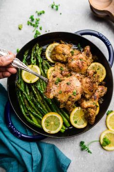 chicken and asparagus stir fry in a skillet