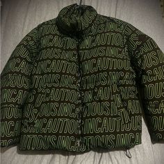 Green And Black Bubble Coat With ( Incautious ) Lettering Print, Great Condition Worn Only 2 Times Black Letter Print Winter Outerwear, Zara Multicolor Long Sleeve Outerwear, Bubble Coat, Zara Jackets, Zara Black, Mens Jackets, Puffer, Zara, Jackets & Coats