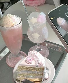 there are two desserts on the tray next to each other, and one has a cell phone