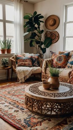 a living room filled with lots of furniture and plants on top of a wooden table