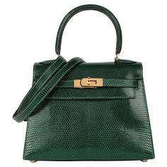 Hermès Vert Moyen Lizard Leather Vintage Kelly 20cm Sellier Brand- Hermès Model- Kelly 20cm Product Type- Shoulder, Top Handle Serial Number- [C* Age- Circa 1999 Accompanied By- Hermes Dust Bag, Shoulder Strap Colour- Vert Moyen Hardware- Gold Material(s)- Lizard Leather Height- 14cm Width- 20cm Depth- 9cm Handle Drop- 8cm Strap Drop- 46cm Interior- Green Leather Closure- Turn Lock Country of Origin- France Condition Rating- Excellent Exterior Condition- The exterior is in excellent condition wi Vintage Hermes Bag, Hermes Kelly 25, Vintage Kelly, Bag Outfit, Kelly Bag, Vintage Hermes, Jane Birkin, Hermes Bag, Green Bag