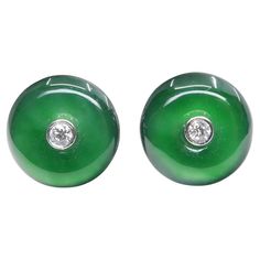 Please check out the HD video! It does not get much better than this! Here is a nice pair of imperial green Jade earrings. Each earring is about 11.3mm. The earrings are set in 18k white gold and diamonds. There are 2 diamonds in the middle of each jade totaling 0.08cts. The untreated / un-enhanced natural jade is translucent. The color is pure imperial green. These jade are full of life. In fact it glows. Photos does not do these earrings justice. This would be a great gift for that special som Jade Earrings, Natural Jade, Green Jade, Jewelry Business, Jade Green, Jewelry Earrings Studs, Green Colors, Diamond Earrings, Persona