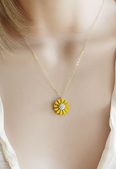 "This pendant is from my vintage garden collection, sweet adorable tiny yellow enamel daisy measures 50\" in diameter. Hangs from a new 14 karat gold filled cable chain . Spring closure clasp. The Daisy is vintage an in mint condition The model is wearing a 16\" length. H A N D M A D E * We hand make all pieces in our Water Mill New York studio * We source eco friendly packaging and materials, including recyclable mailers! FREE BOX AND WRAP ON EVERY ORDER P R O D U C T I O N ∙ T I M E S All item Yellow Necklace With Birth Flower Pendant, Yellow Birth Flower Pendant Necklace, Dainty Yellow Flower Shaped Jewelry, Yellow Flower Necklaces For Jewelry Making, Yellow Flower-shaped Necklaces For Gifts, Yellow Flower Shaped Necklaces For Gifts, Yellow Flower Shaped Jewelry With Adjustable Chain, Yellow Flower Necklaces With Birth Flower Detail, Yellow Flower Shaped Necklace For Gift