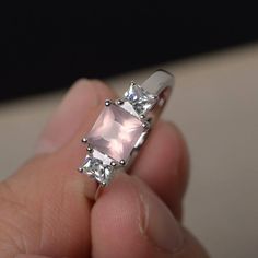 This is a gorgeous handmade creation. Its beauty is its simplicity & Elegance. The 6*6 mm princess cut faceted natural Pink Quartz is crafted in solid sterling silver and with rhodium plated. All item is sent in a beautiful gift box If you have any idea of design your ring,pls contact me directly. You can realize more lovely stuff clicking the link https://www.etsy.com/shop/knightjewelry?refshopsection_shophome_leftnav Please leave the correct address and you phone number for delivering succ Pink Gem Ring, Rose Quartz Rings, Rings Princess Cut, Statement Rings Unique, Proposal Rings, Princess Cut Rings, Rings Silver, Birthday Ring, Rose Quartz Ring