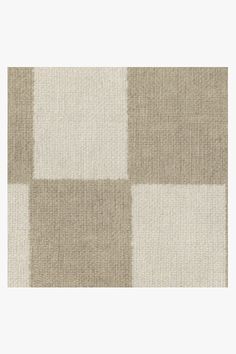 a beige and white checkered rug