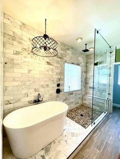 a bathroom with a large tub and walk in shower